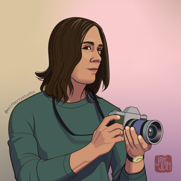 Latina woman with shoulder length hair holding camera